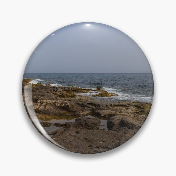 Item preview, Crashing Ocean Waves Over Rocky Shoreline With White Foam Splash And Textured Rocks designed and sold by Nmallia.