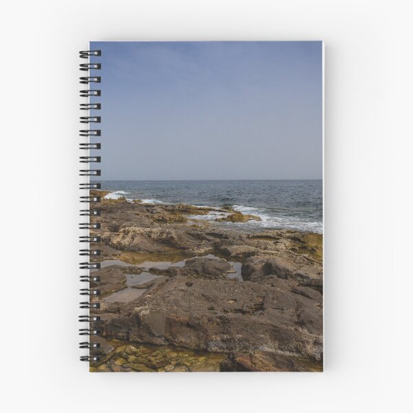 Item preview, Crashing Ocean Waves Over Rocky Shoreline With White Foam Splash And Textured Rocks designed and sold by Nmallia.