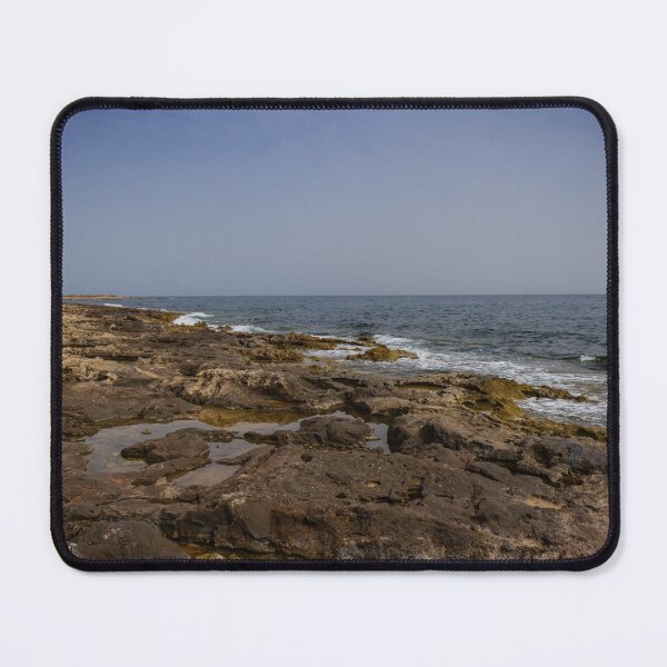 Item preview, Crashing Ocean Waves Over Rocky Shoreline With White Foam Splash And Textured Rocks designed and sold by Nmallia.