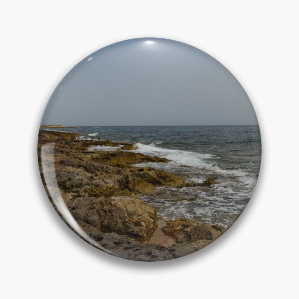 Item preview, Crashing Ocean Waves Over Rocky Shoreline With White Foam Splash And Textured Rocks designed and sold by Nmallia.
