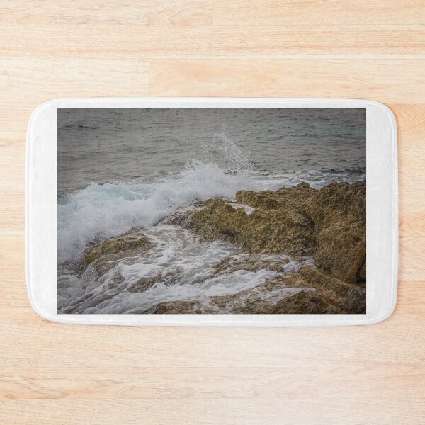 Item preview, Crashing Ocean Waves Over Rocky Shoreline With White Foam Splash And Textured Rocks designed and sold by Nmallia.