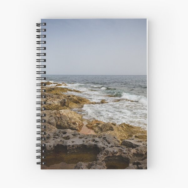 Item preview, Crashing Ocean Waves Over Rocky Shoreline With White Foam Splash And Textured Rocks designed and sold by Nmallia.