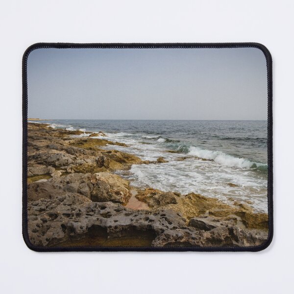 Item preview, Crashing Ocean Waves Over Rocky Shoreline With White Foam Splash And Textured Rocks designed and sold by Nmallia.