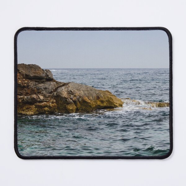 Item preview, Crashing Ocean Waves Over Rocky Shoreline With White Foam Splash And Textured Rocks designed and sold by Nmallia.