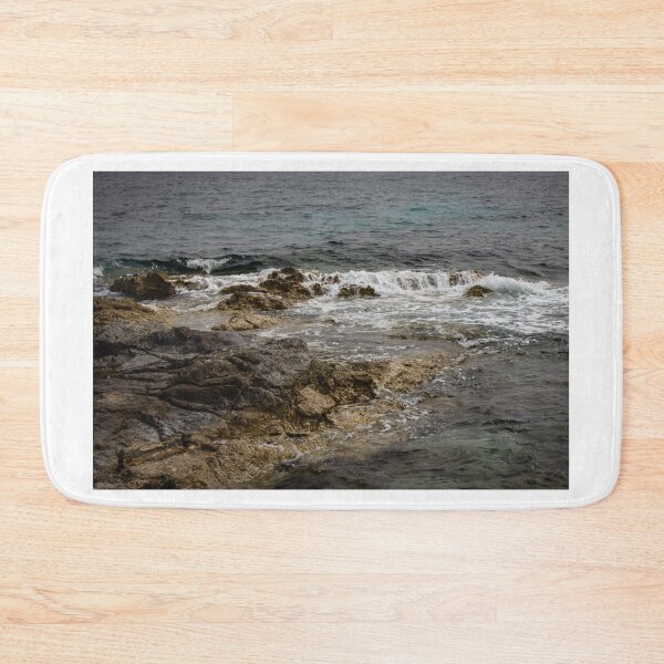 Item preview, Crashing Ocean Waves Over Rocky Shoreline With White Foam Splash And Textured Rocks designed and sold by Nmallia.