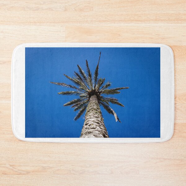 Item preview, Looking Up At Tall Palm Tree Against Clear Deep Blue Sky On A Sunny Day designed and sold by Nmallia.