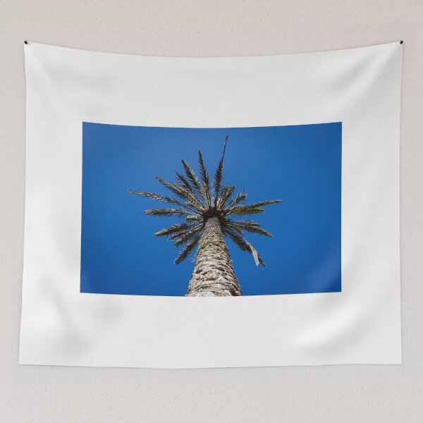 Item preview, Looking Up At Tall Palm Tree Against Clear Deep Blue Sky On A Sunny Day designed and sold by Nmallia.