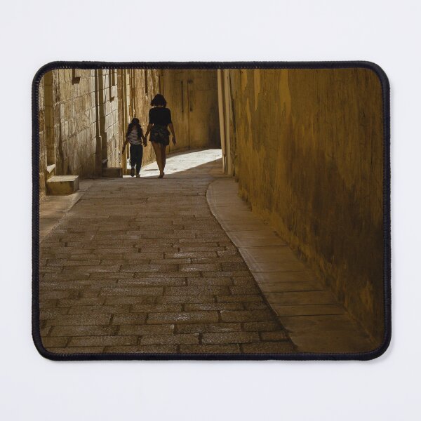 Item preview, Mother And Daughter Walking Hand In Hand Through Narrow Cobblestone Alley In Historic Old Town designed and sold by Nmallia.