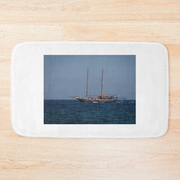 Item preview, Wooden Two-Masted Yacht Sailing On Calm Blue Sea With Passengers Under Clear Sky designed and sold by Nmallia.