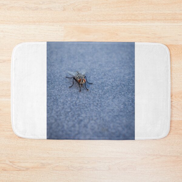 Item preview, Macro Close-Up Of A Housefly With Red Eyes On A Blue Textured Surface designed and sold by Nmallia.