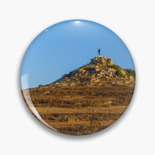 Item preview, Solitary Statue on Rocky Hill Overlooking Winding Trail Through Golden Dry Grass Under Blue Sky designed and sold by Nmallia.