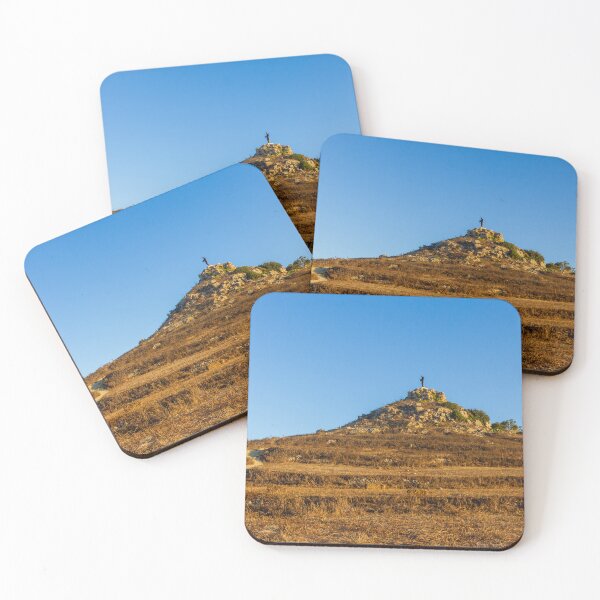 Item preview, Solitary Statue on Rocky Hill Overlooking Winding Trail Through Golden Dry Grass Under Blue Sky designed and sold by Nmallia.