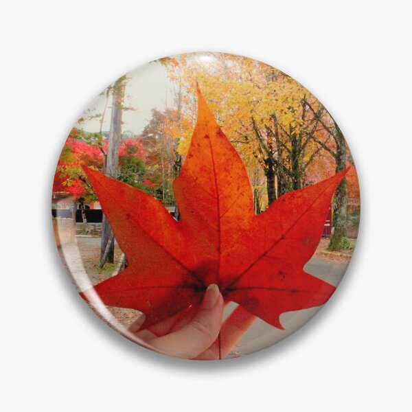 Item preview, Autumn Magic: Holding a Red Maple Leaf. Vibrant Red Autumn Maple Leaf in Hand designed and sold by TaynaraVieira.
