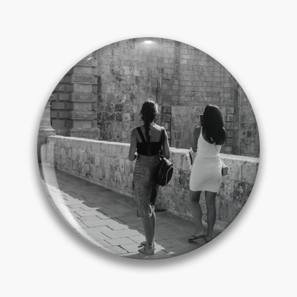 Item preview, Two Women Walking Along Historic Stone Ramparts by Ancient Arch in Mediterranean Old Town designed and sold by Nmallia.