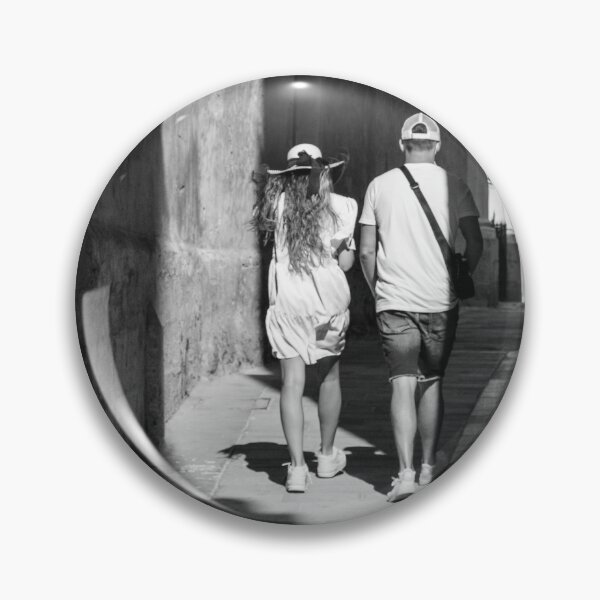 Item preview, Couple Walking Down Narrow Sunlit European Alleyway in Black and White Street Photography designed and sold by Nmallia.