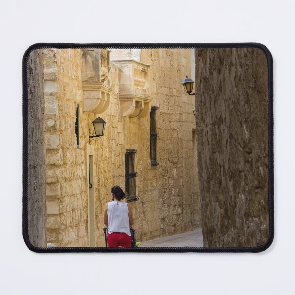 Item preview, Woman Pushing Stroller Through Narrow Historic Stone Alley in Old Town on Sunny Day designed and sold by Nmallia.