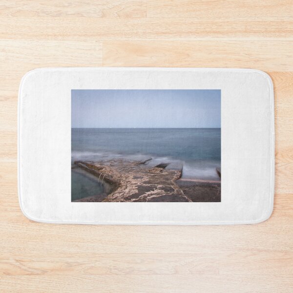 Item preview, Calm Rocky Coastline With Concrete Pier and Metal Ladder Overlooking Misty Sea at Twilight designed and sold by Nmallia.