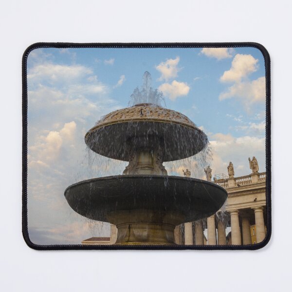 Item preview, Historic Fountain at St. Peter's Square With Colonnade Statues Under a Blue Sky designed and sold by Nmallia.