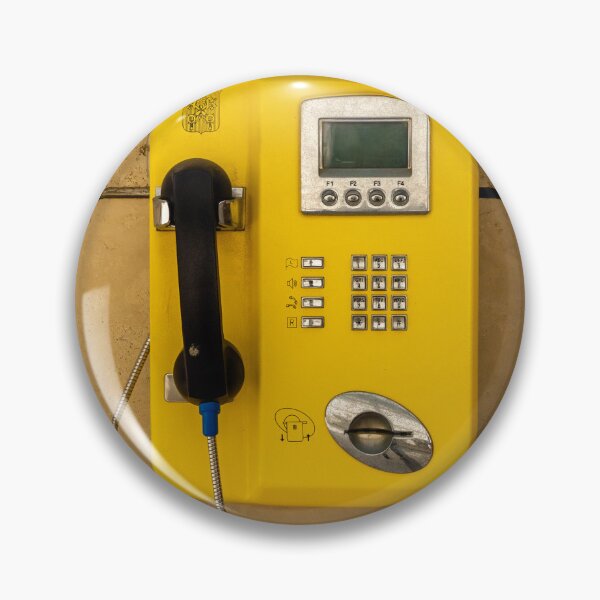 Item preview, Yellow Public Payphone Mounted on Stone Wall With Handset, Coin Slot and Tourist Posters designed and sold by Nmallia.