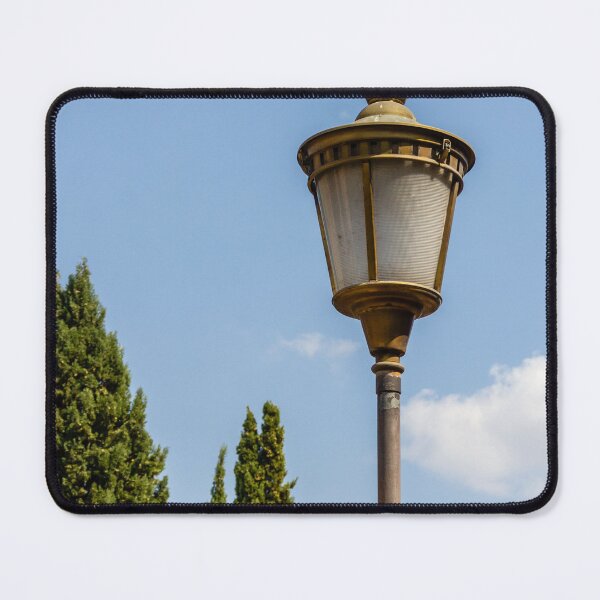 Item preview, Vintage Street Lamp Post Against Clear Blue Sky With Cypress Trees in Sunny Park designed and sold by Nmallia.