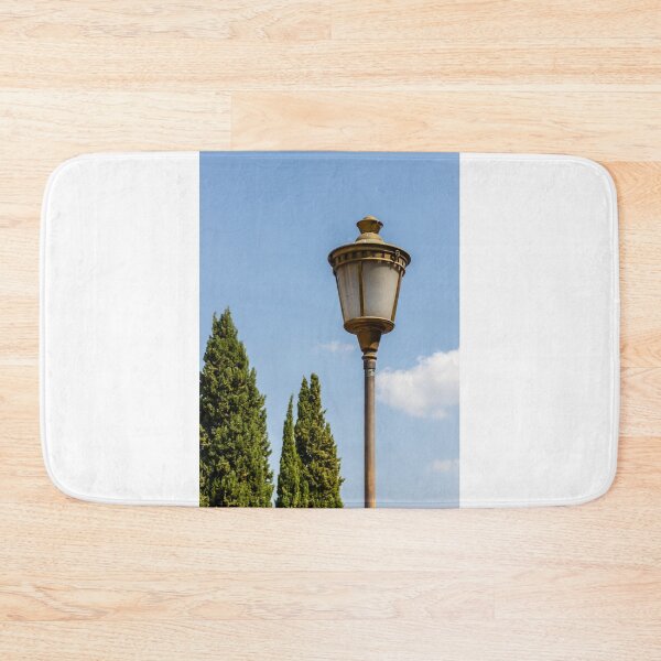 Item preview, Vintage Street Lamp Post Against Clear Blue Sky With Cypress Trees in Sunny Park designed and sold by Nmallia.