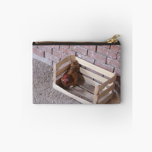 Item preview, Country hen lays her eggs in a wooden cage and looks at the camera designed and sold by zuhairiphotos.
