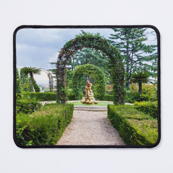 Item preview, Formal Garden Path Leading to Ornamental Fountain and Statue Through Green Arched Vines designed and sold by Nmallia.
