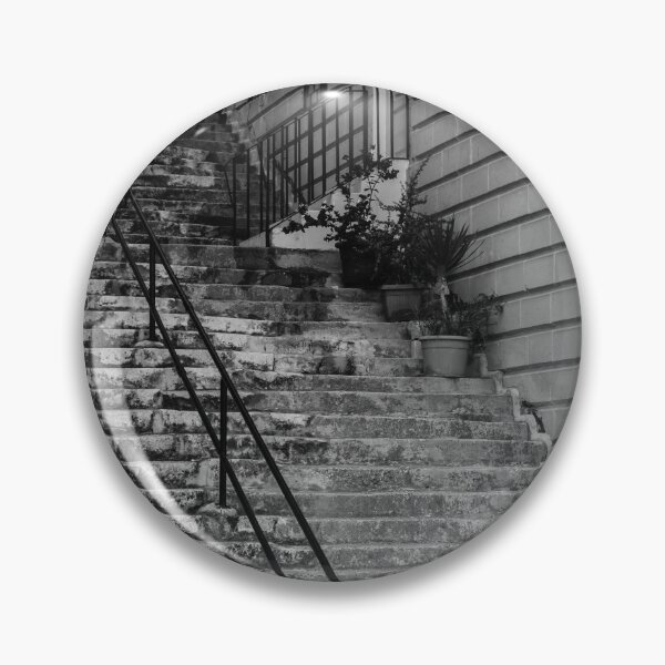 Item preview, Weathered Stone Steps With Iron Railing Beside Historic Urban Building In Monochrome designed and sold by Nmallia.