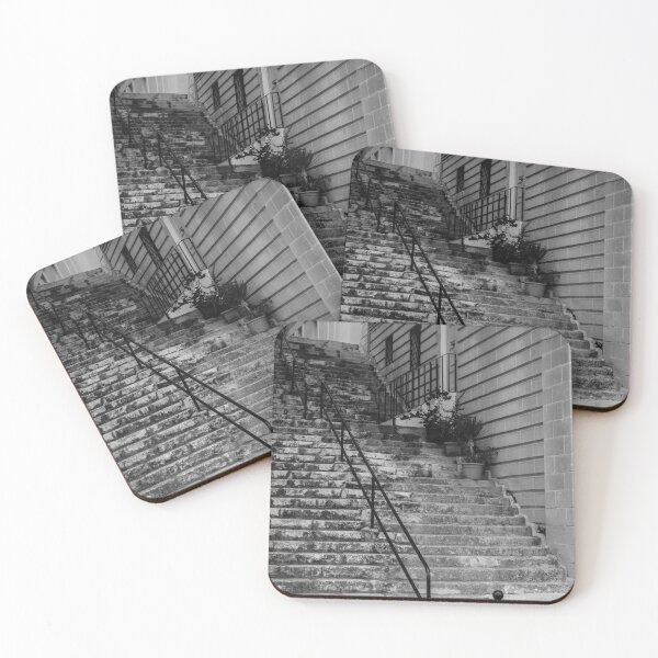 Item preview, Weathered Stone Steps With Iron Railing Beside Historic Urban Building In Monochrome designed and sold by Nmallia.