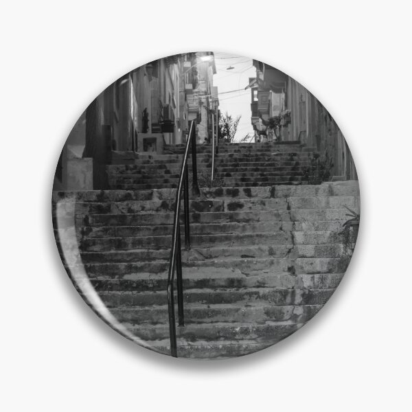 Item preview, Weathered Stone Steps With Iron Railing Beside Historic Urban Building In Monochrome designed and sold by Nmallia.