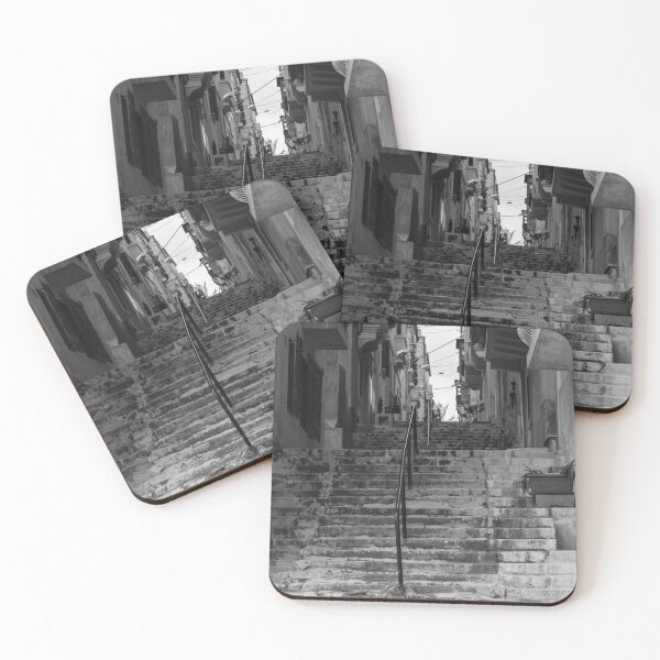 Item preview, Weathered Stone Steps With Iron Railing Beside Historic Urban Building In Monochrome designed and sold by Nmallia.