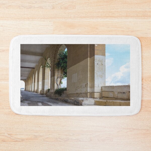 Item preview, Historic Stone Colonnade With Arched Walkway, Ivy‑Clad Columns and Bright Mediterranean Sky designed and sold by Nmallia.