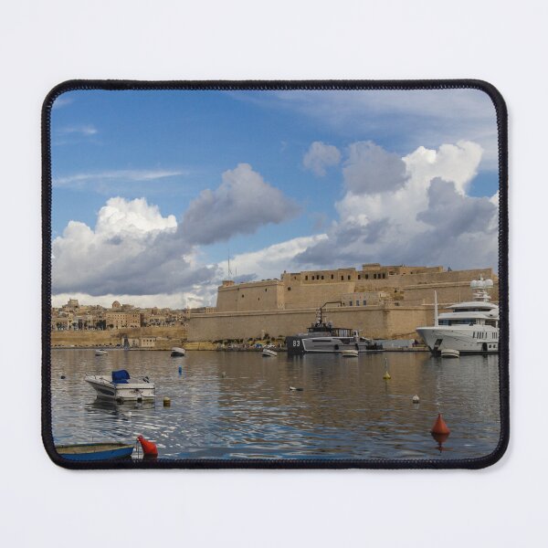 Item preview, Yachts and Small Boats Docked in Historic Harbour Beside Ancient Fort Walls Under Dramatic Sky designed and sold by Nmallia.
