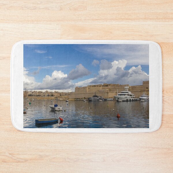 Item preview, Yachts and Small Boats Docked in Historic Harbour Beside Ancient Fort Walls Under Dramatic Sky designed and sold by Nmallia.