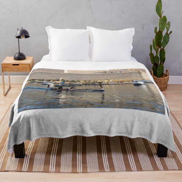 Item preview, Traditional Maltese Dgħajsa Boat Carrying Tourists Along Valletta Harbour With Limestone Fortifications designed and sold by Nmallia.