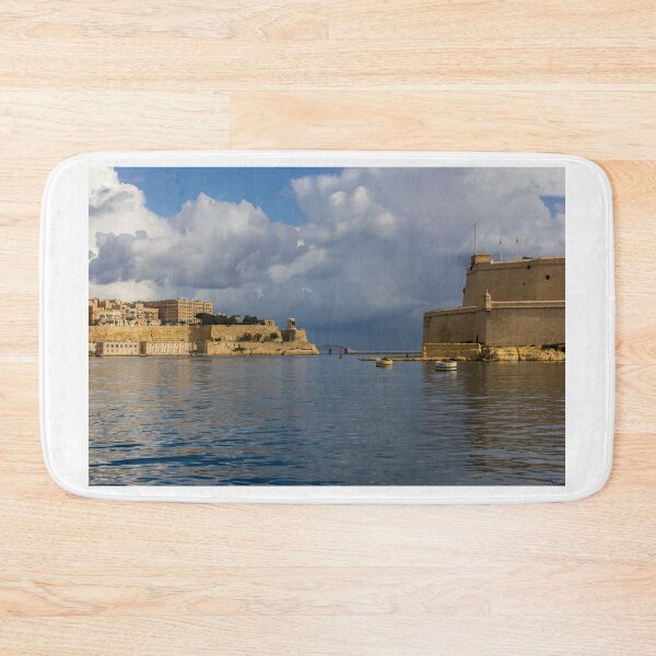 Item preview, Historic Mediterranean Harbor With Stone Fort, Calm Water and Dramatic Cloud Sky designed and sold by Nmallia.