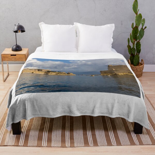 Item preview, Historic Mediterranean Harbor With Stone Fort, Calm Water and Dramatic Cloud Sky designed and sold by Nmallia.