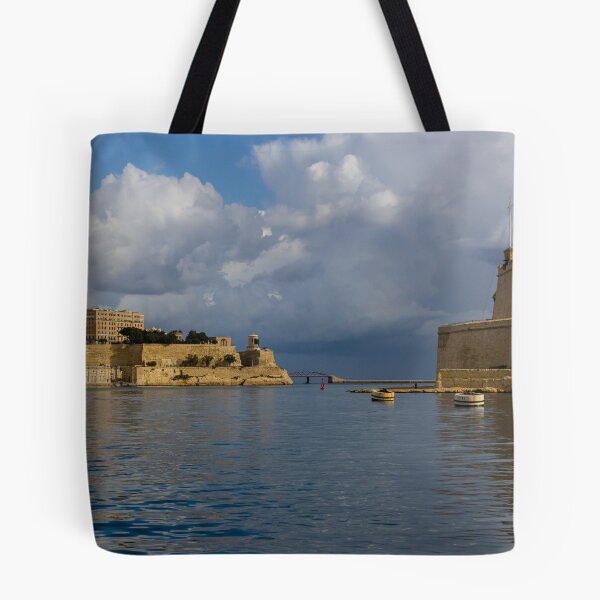 Item preview, Historic Mediterranean Harbor With Stone Fort, Calm Water and Dramatic Cloud Sky designed and sold by Nmallia.