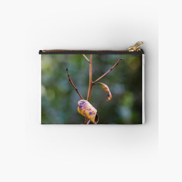Item preview, Dried Yellow Leaf On Thin Branch With Soft Bokeh Background Evoking Autumn Fragility designed and sold by Nmallia.