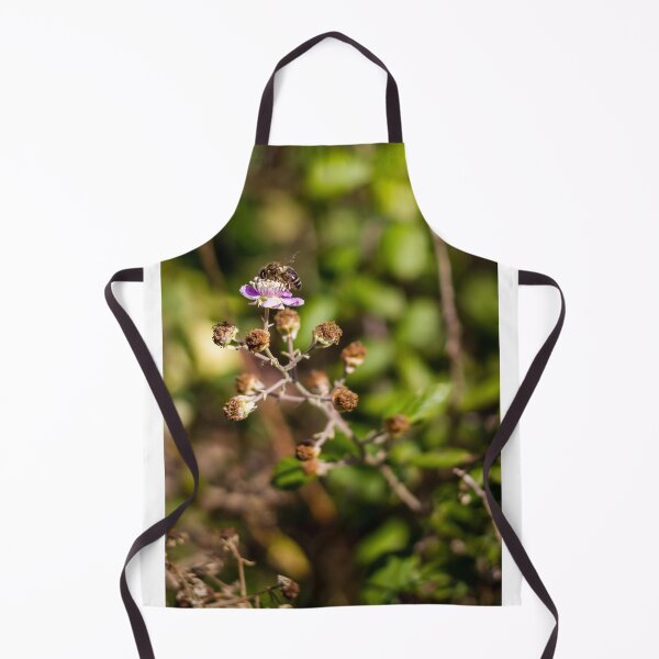 Item preview, Honey Bee Pollinating Pink Wildflower Macro Shot In Green Garden With Soft Bokeh Background designed and sold by Nmallia.