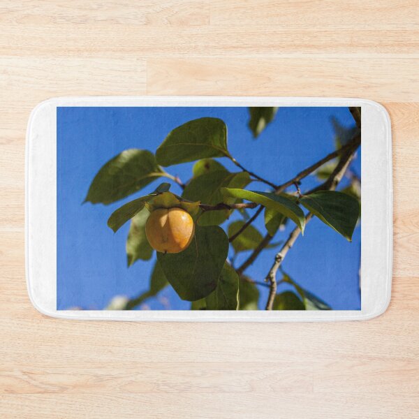 Item preview, Ripe Persimmon Fruit Hanging on Tree Branch Against Clear Blue Sky in Autumn Garden designed and sold by Nmallia.