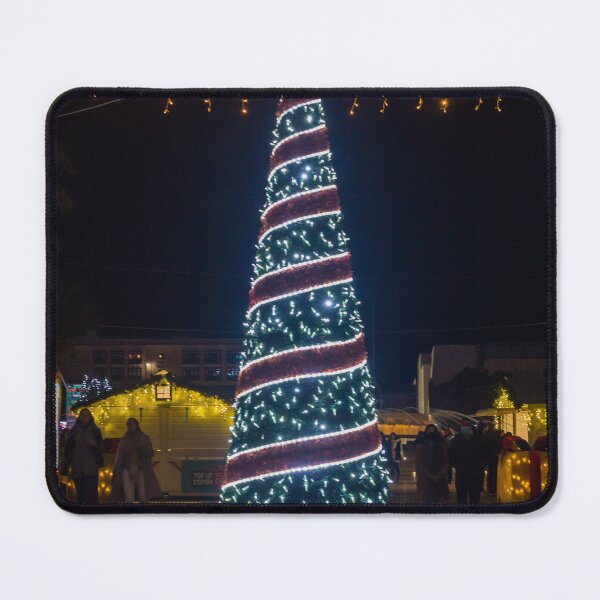 Item preview, Christmas Tree With Blue Lights In City Street At Night Surrounded By Shoppers And Festive Decorations designed and sold by Nmallia.