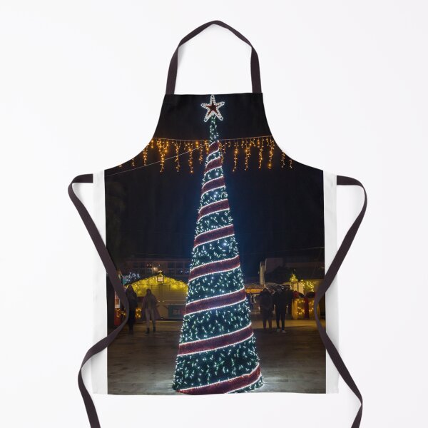 Item preview, Christmas Tree With Blue Lights In City Street At Night Surrounded By Shoppers And Festive Decorations designed and sold by Nmallia.