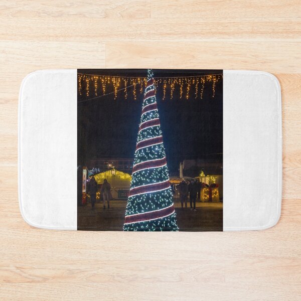 Item preview, Christmas Tree With Blue Lights In City Street At Night Surrounded By Shoppers And Festive Decorations designed and sold by Nmallia.
