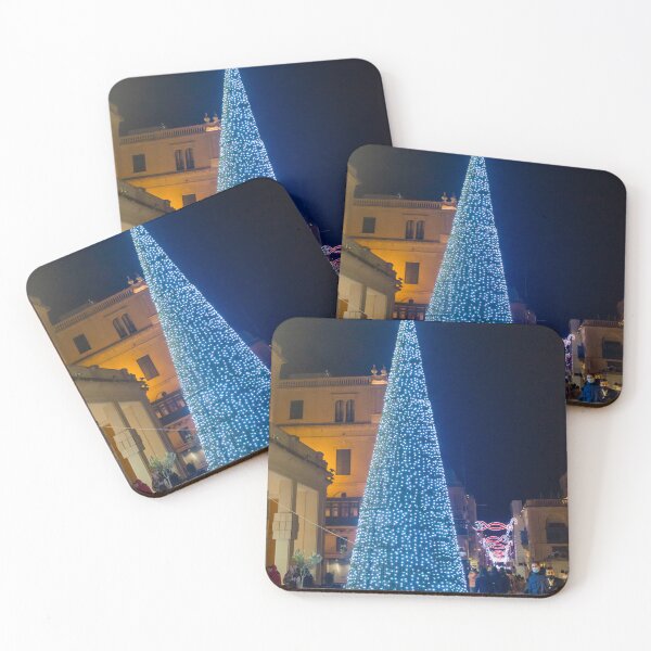 Item preview, Christmas Tree With Blue Lights In City Street At Night Surrounded By Shoppers And Festive Decorations designed and sold by Nmallia.