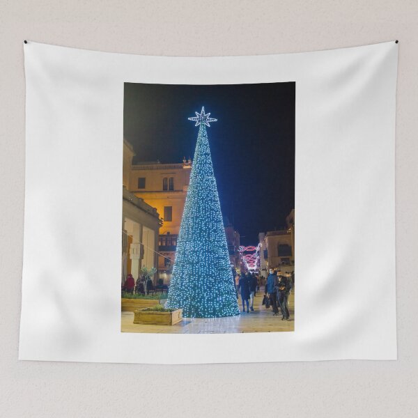 Item preview, Christmas Tree With Blue Lights In City Street At Night Surrounded By Shoppers And Festive Decorations designed and sold by Nmallia.
