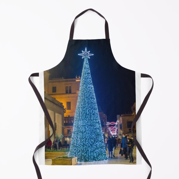 Item preview, Christmas Tree With Blue Lights In City Street At Night Surrounded By Shoppers And Festive Decorations designed and sold by Nmallia.