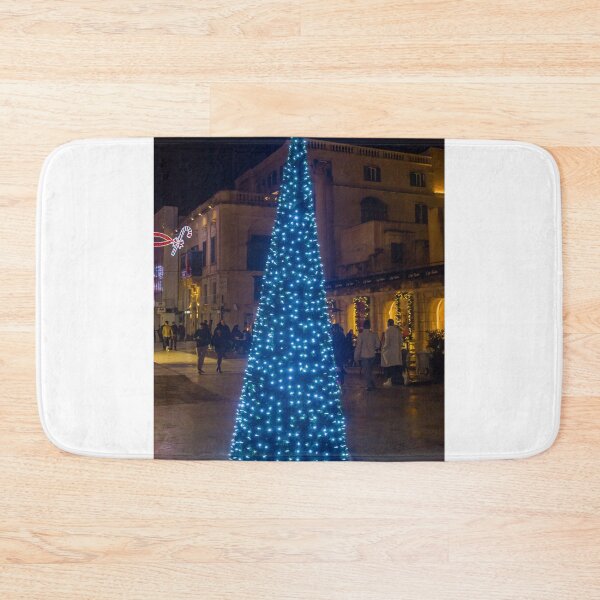 Item preview, Christmas Tree With Blue Lights In City Street At Night Surrounded By Shoppers And Festive Decorations designed and sold by Nmallia.