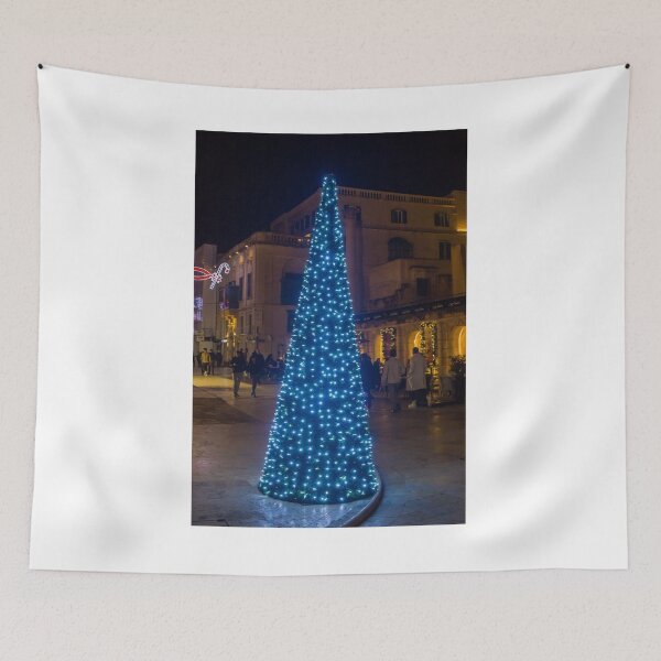 Item preview, Christmas Tree With Blue Lights In City Street At Night Surrounded By Shoppers And Festive Decorations designed and sold by Nmallia.