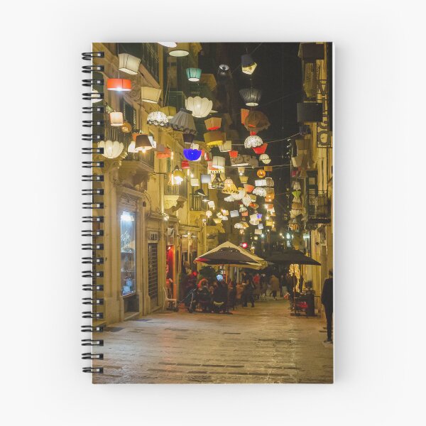 Item preview, Festive Night Street With Hanging Lamps, Christmas Lights and Outdoor Cafes in European City designed and sold by Nmallia.